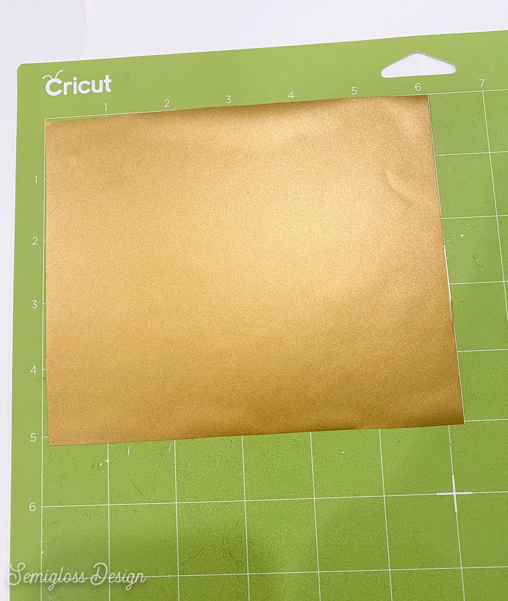 gold vinyl on green cutting mat