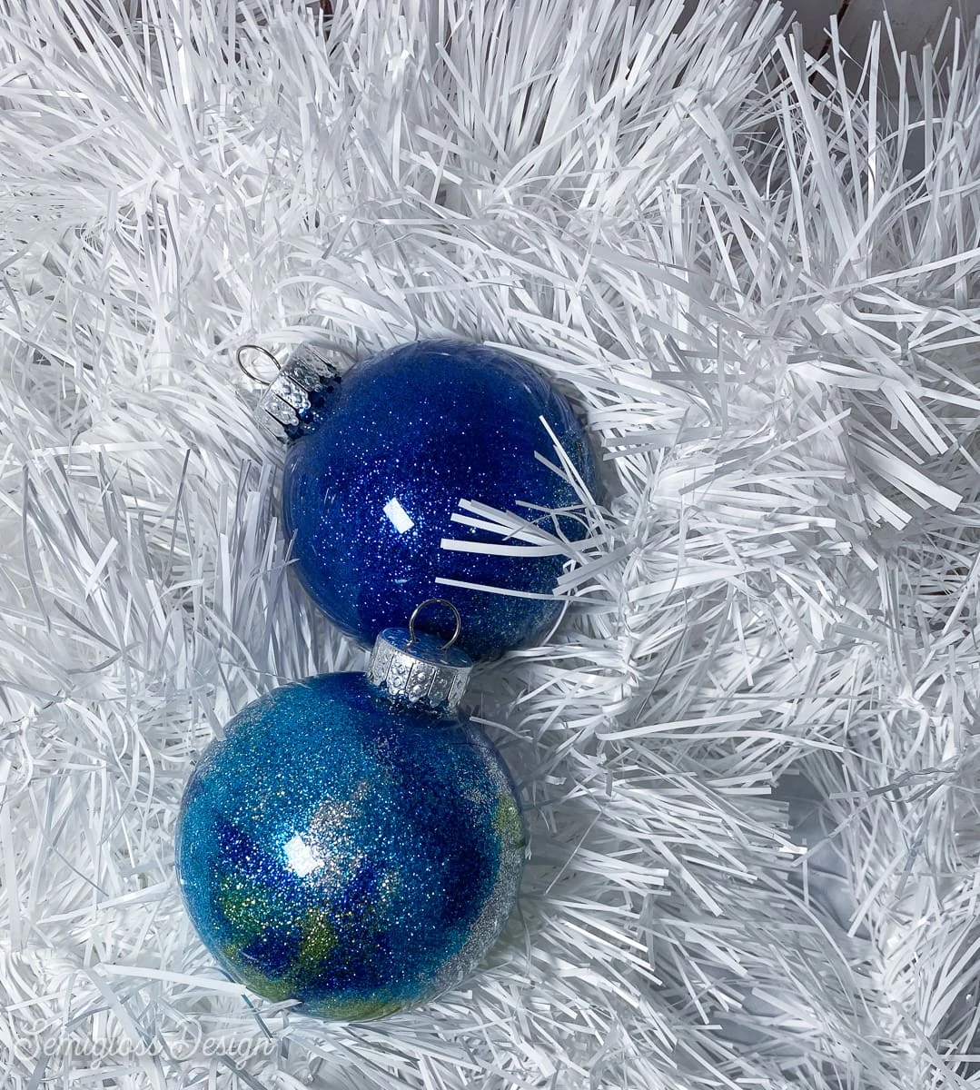 blue glittery ornaments in tinsel