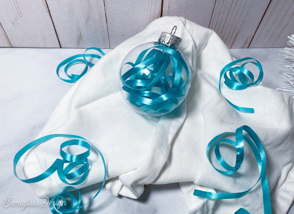 ornament filled with blue curling ribbon