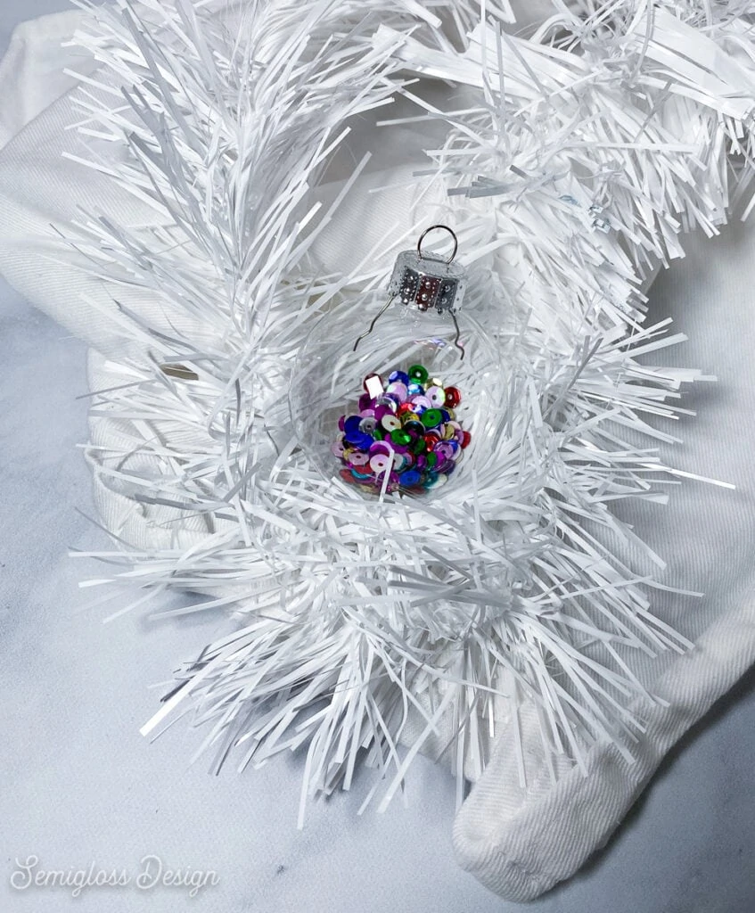 ornament filled with colorful sequins