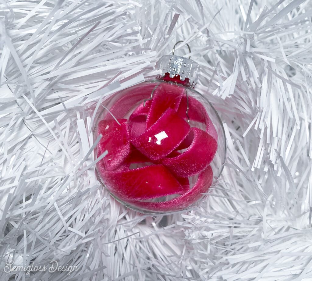 clear glass ornament with pink velvet ribbon