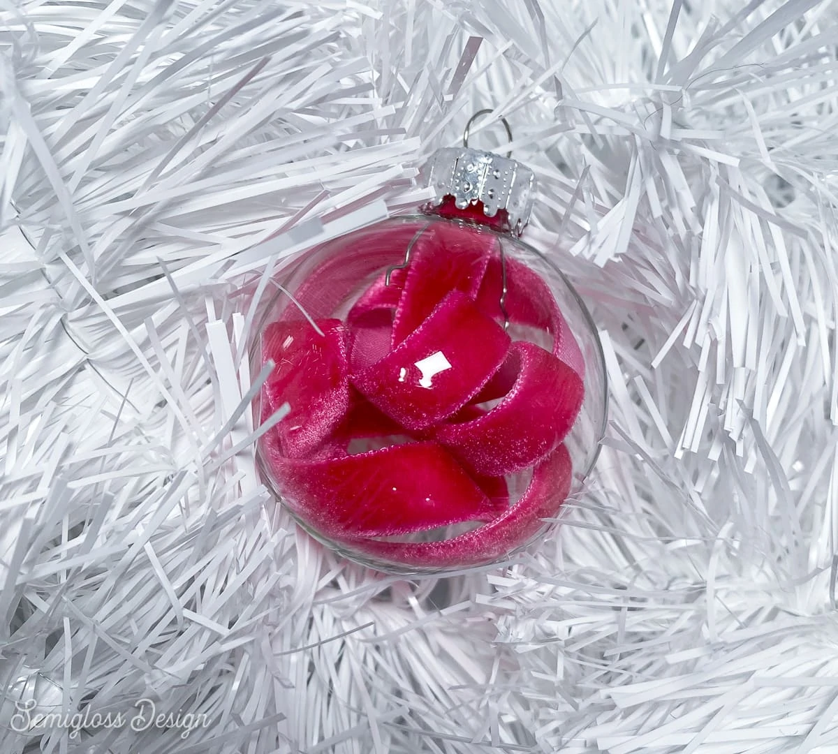clear glass ornament with pink velvet ribbon