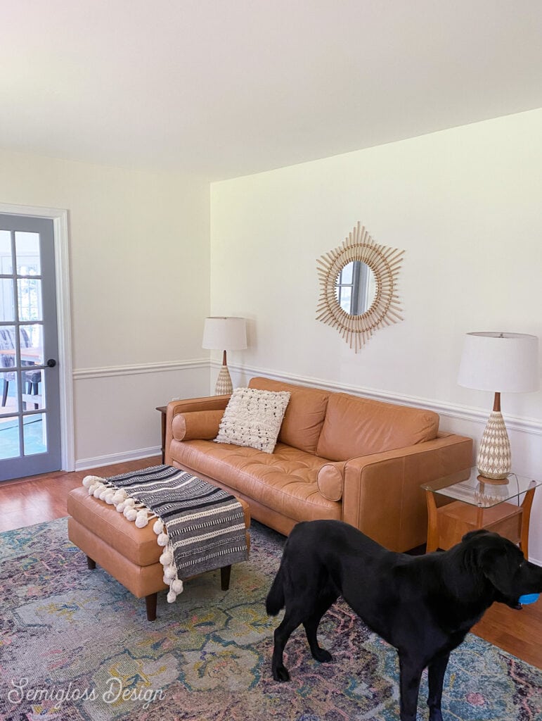 living room with tan leather sofa