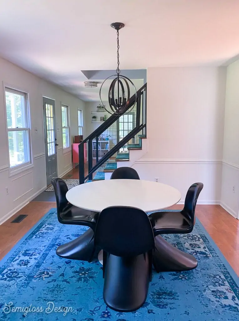 modern dining table on blue rug