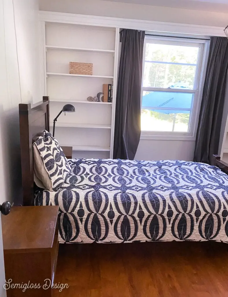 bedroom with black and white bedding