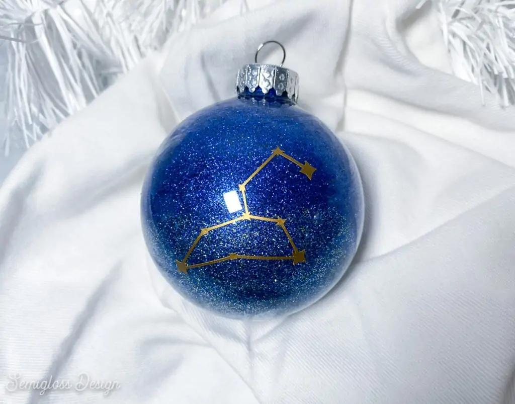 blue glitter galaxy ornament with Leo constellation decal