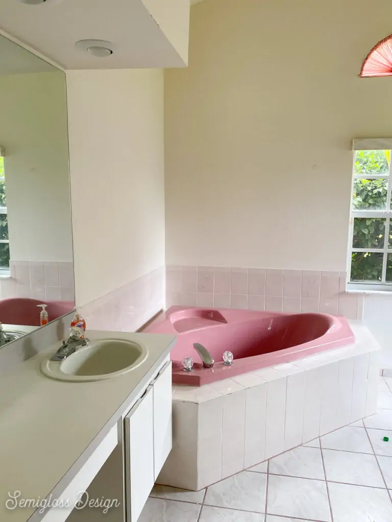 primary bathroom before with pink tub