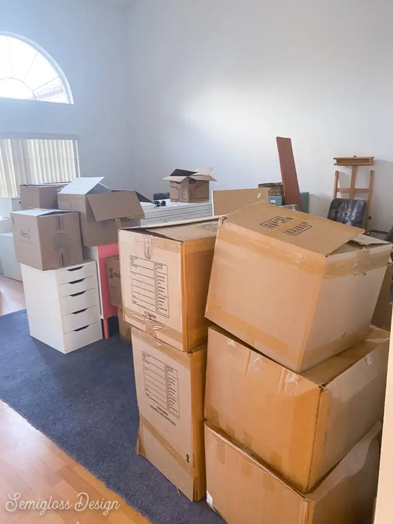 stacks of boxes in living room