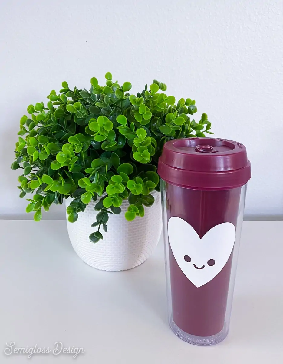 tumbler with happy heart by plant