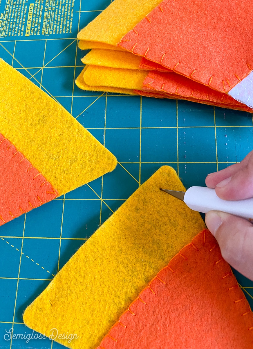 cutting slits for string in banner