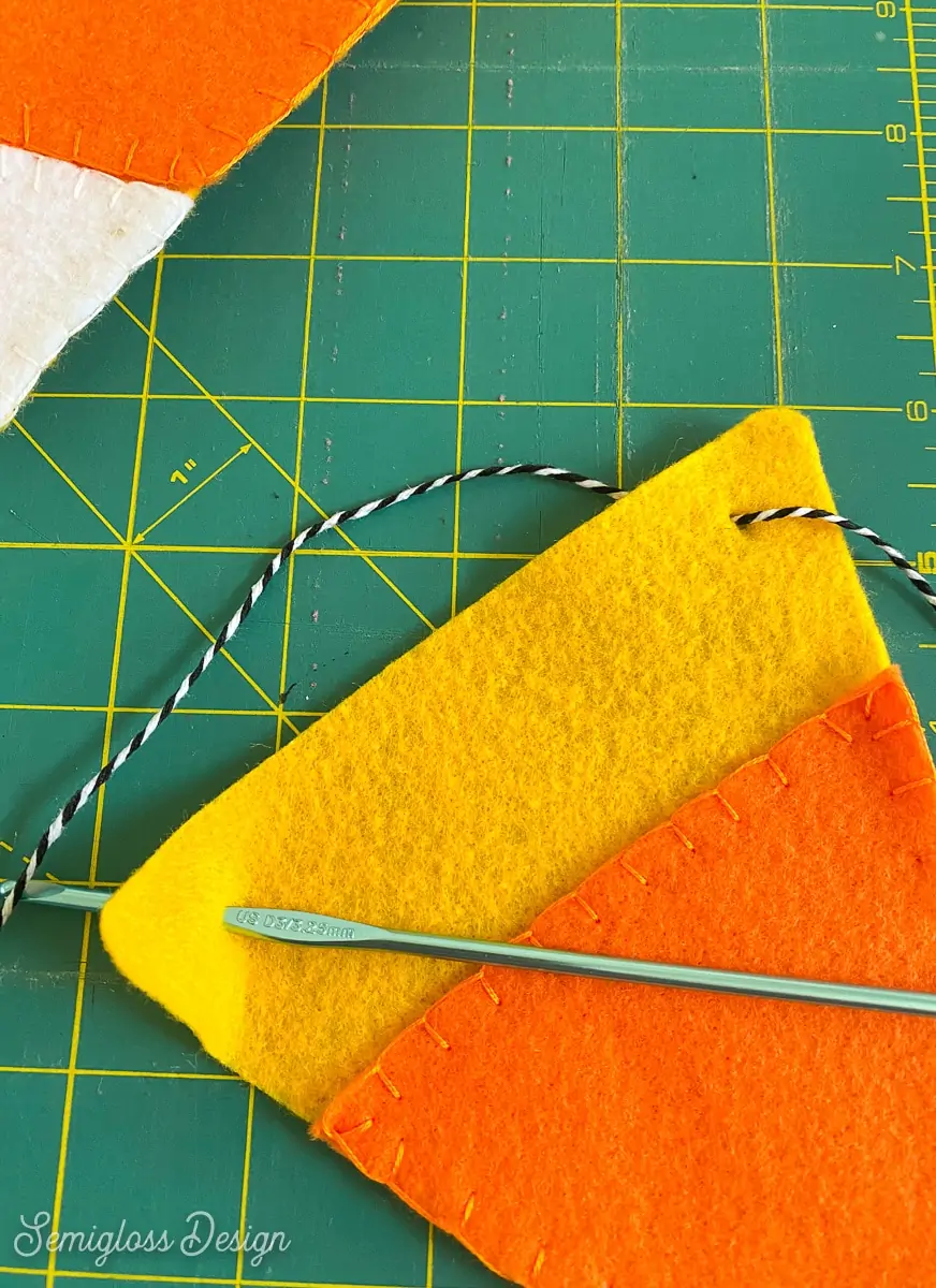 using crochet hook to thread string in banner