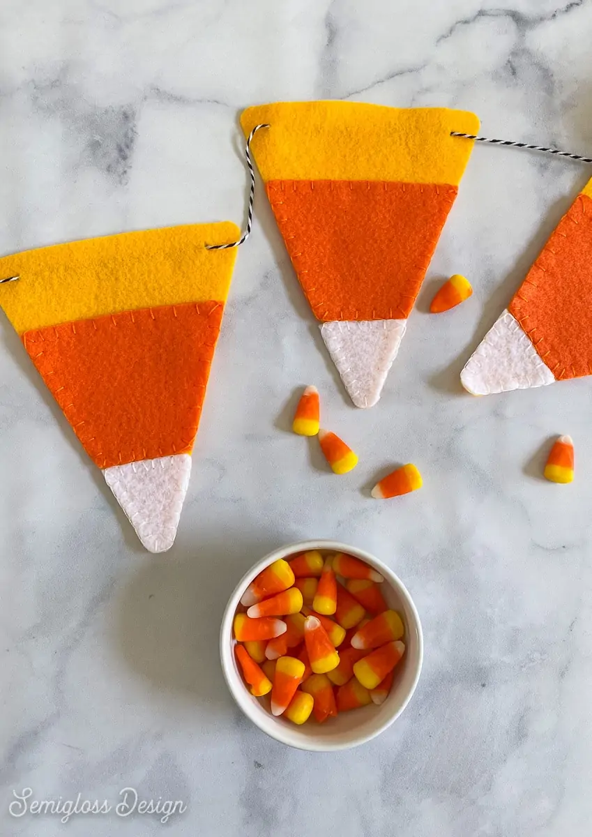 felt candy corn banner with bowl of candy