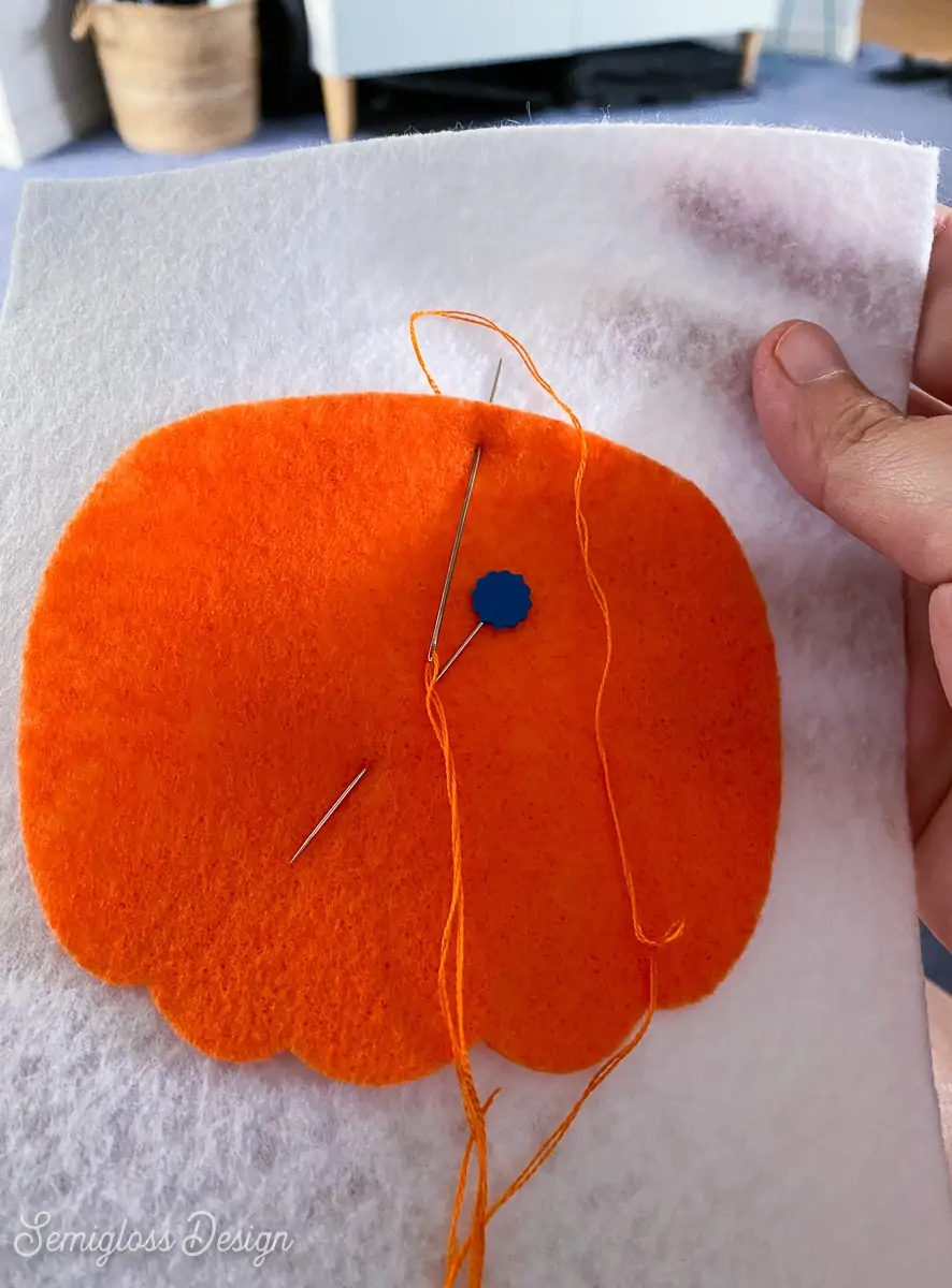 pumpkin shape pinned to felt banner