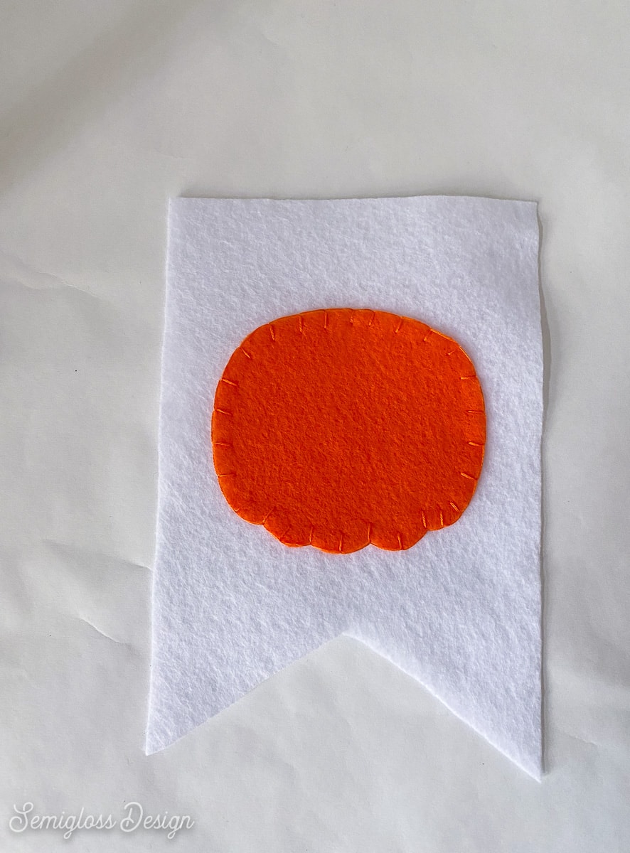 felt pumpkin sewn to banner