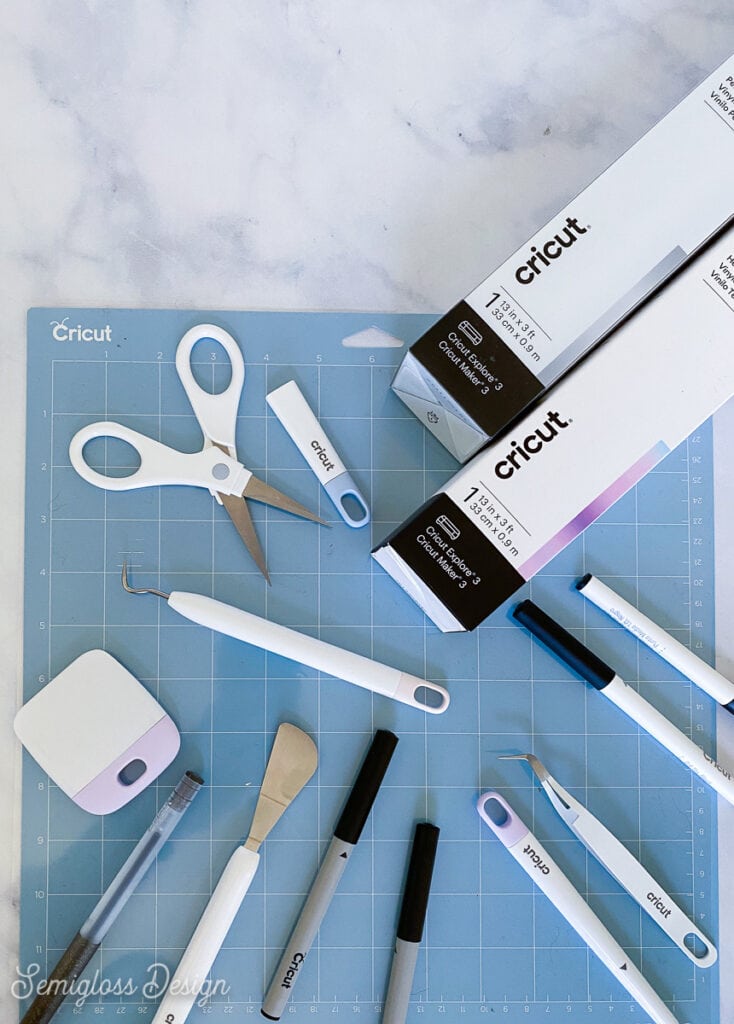 cricut supplies on blue cutting mat