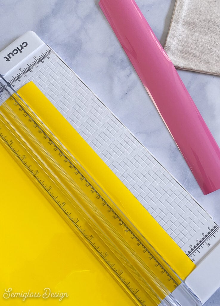 trimming excess vinyl with paper trimmer