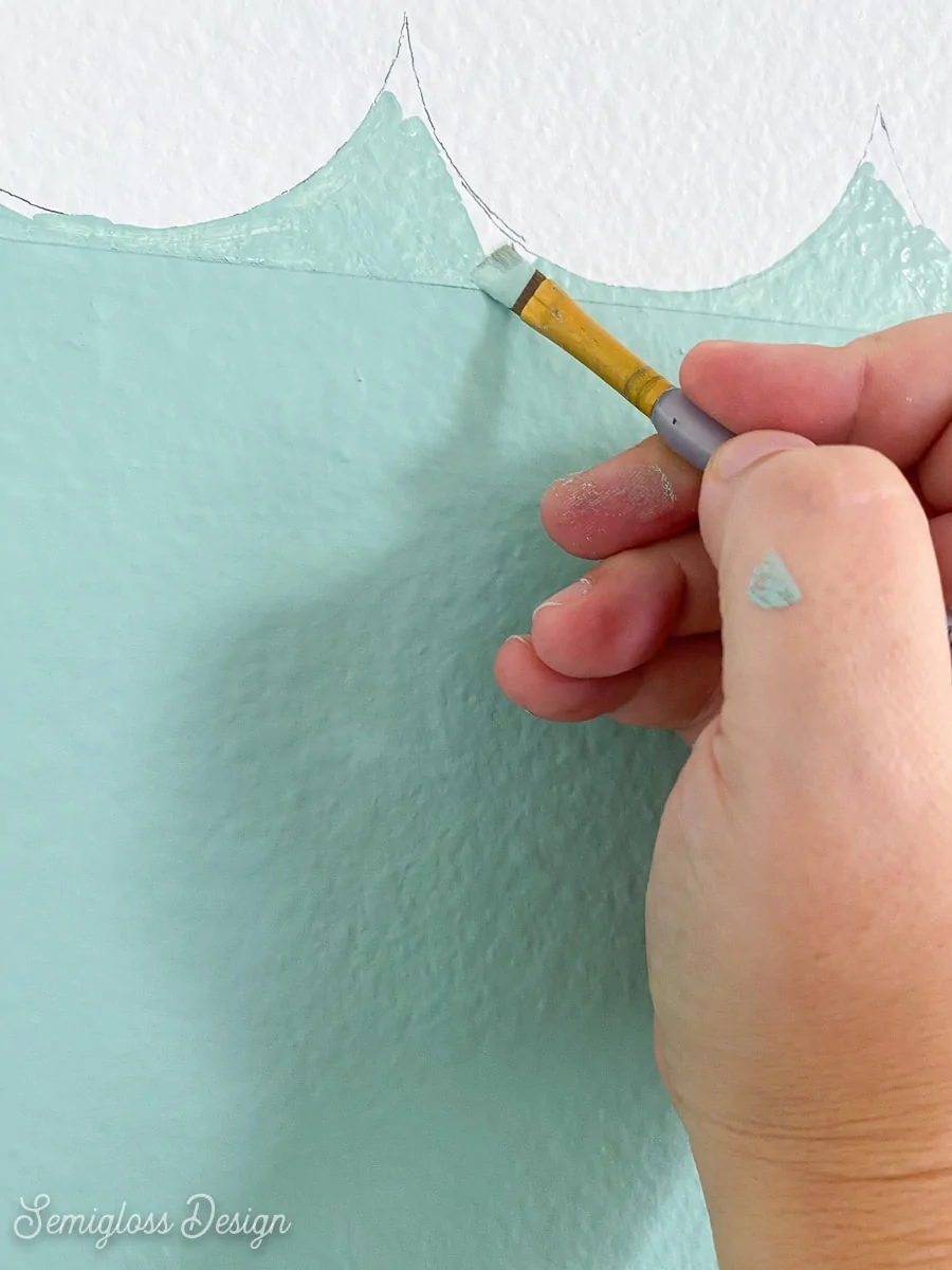 using craft brush to paint scallop wall details