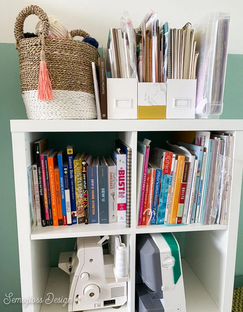 craft books and sewing machines in shelf