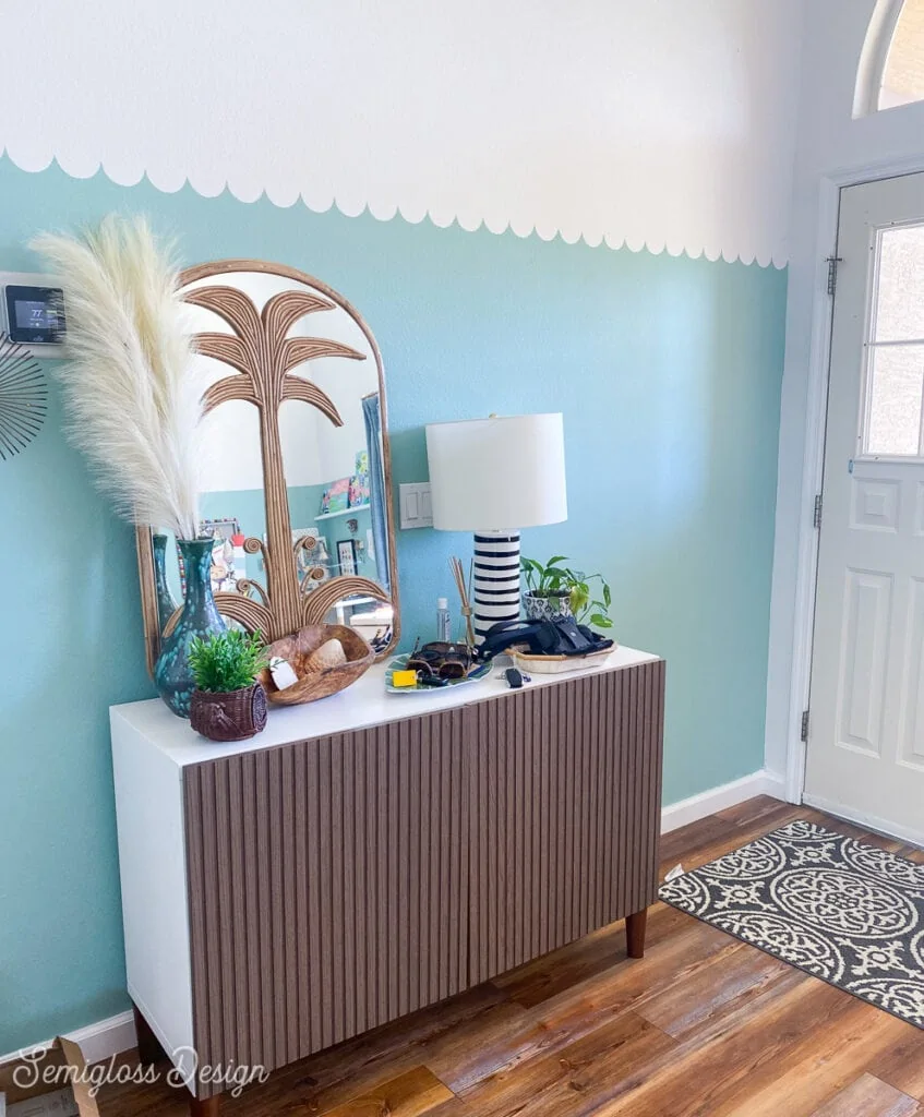 aqua scalloped walls and palm tree mirror