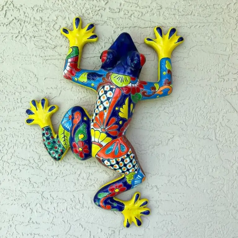 ceramic frog on wall