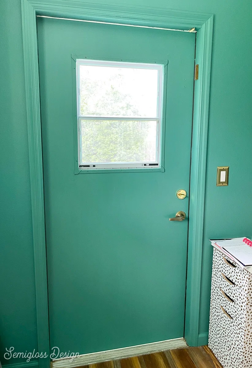 painted green door in green room