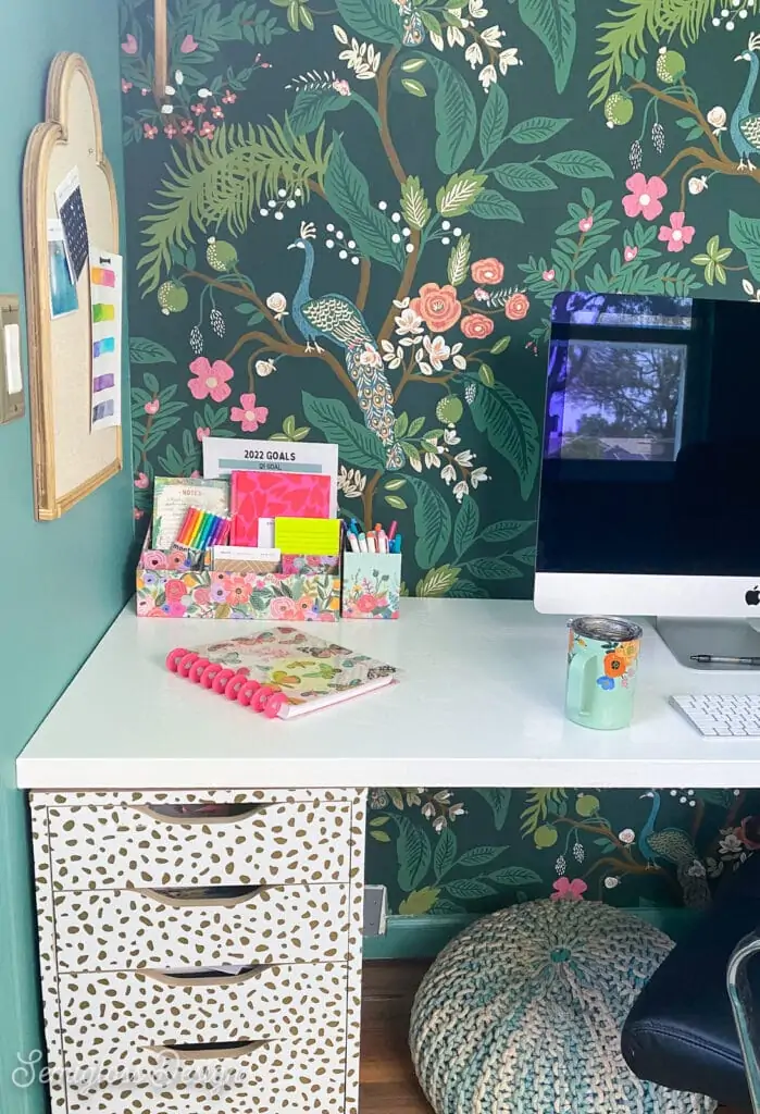 computer desk wit floral wallpaper 