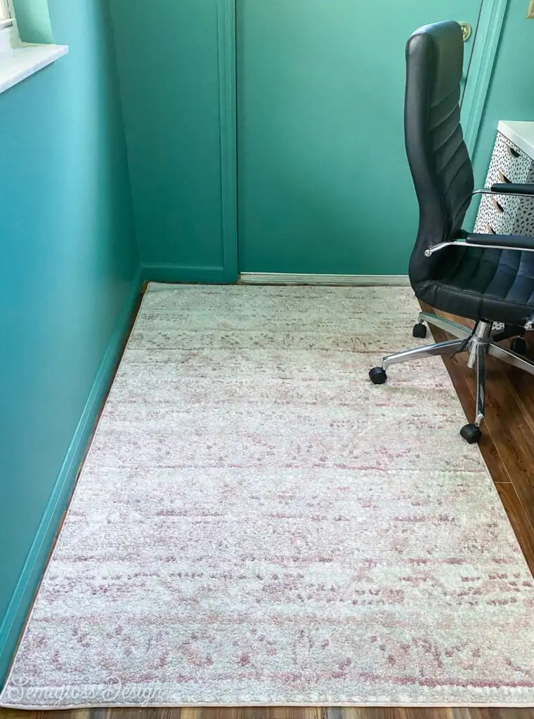 pink rug in green room
