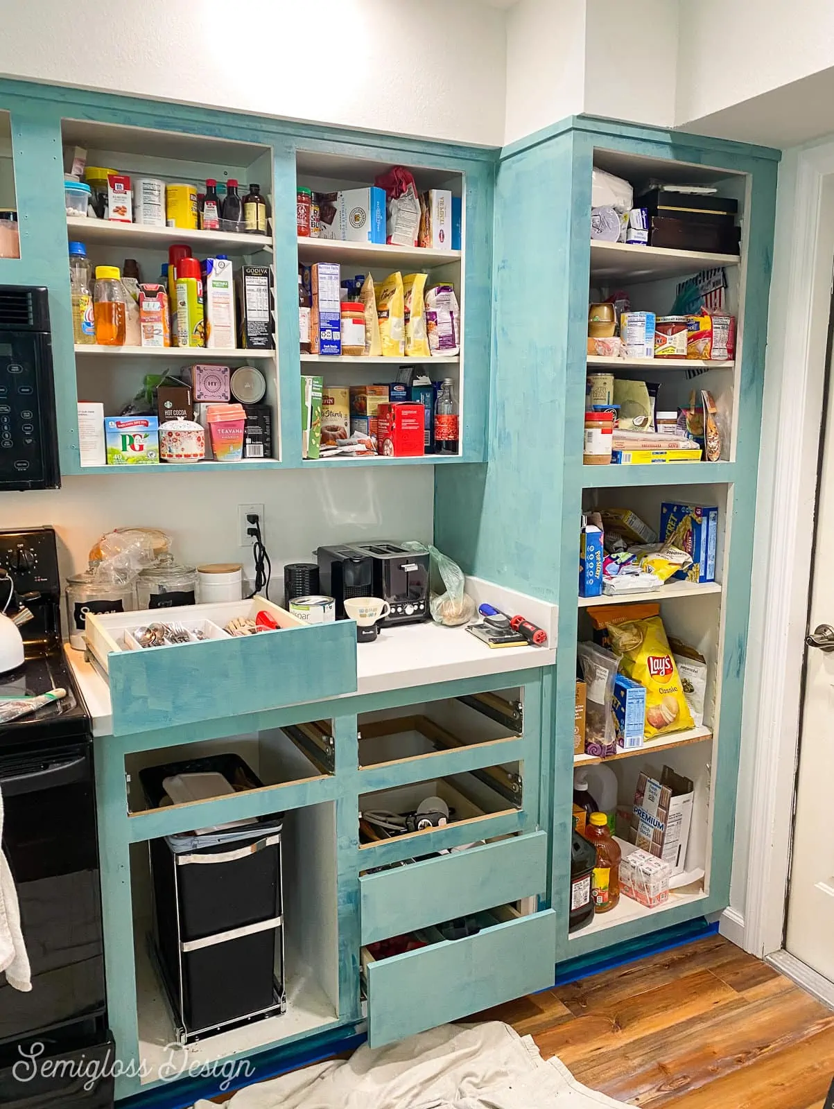 kitchen cabinets being painted in progress