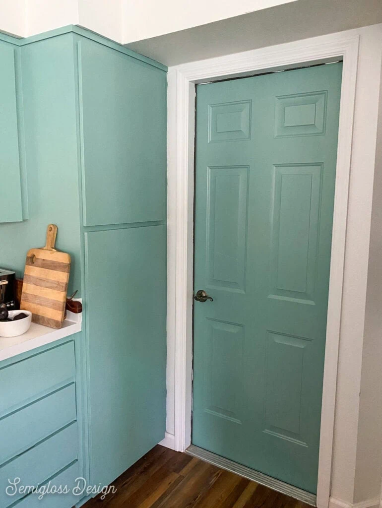 aqua painted kitchen cabinets and door