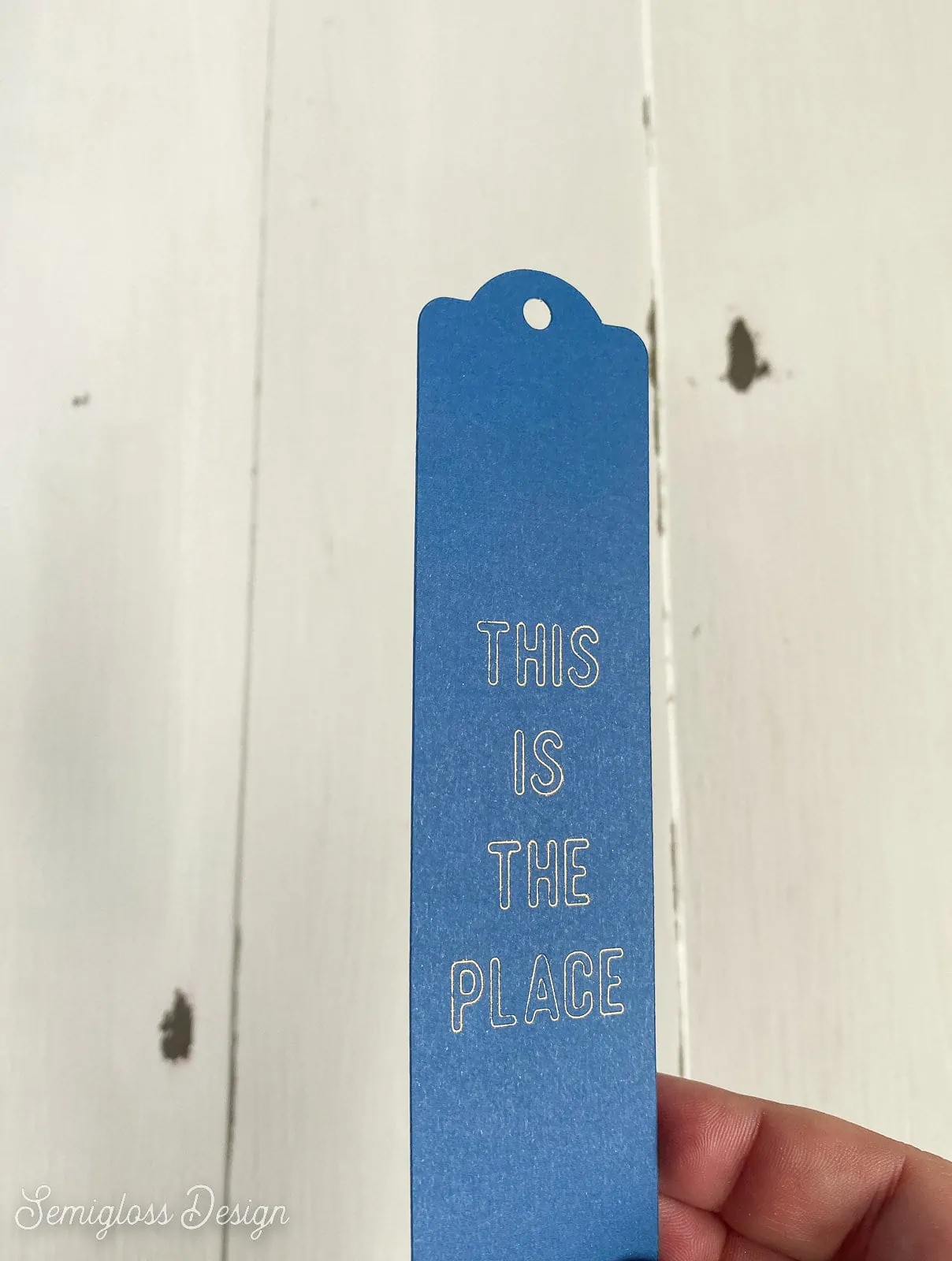 blue bookmark with gold lettering