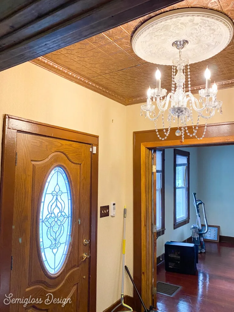 foyer with metal ceiling and chandelier