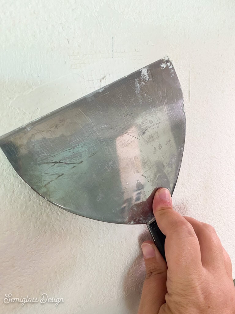 covering hole with joint compound and tape