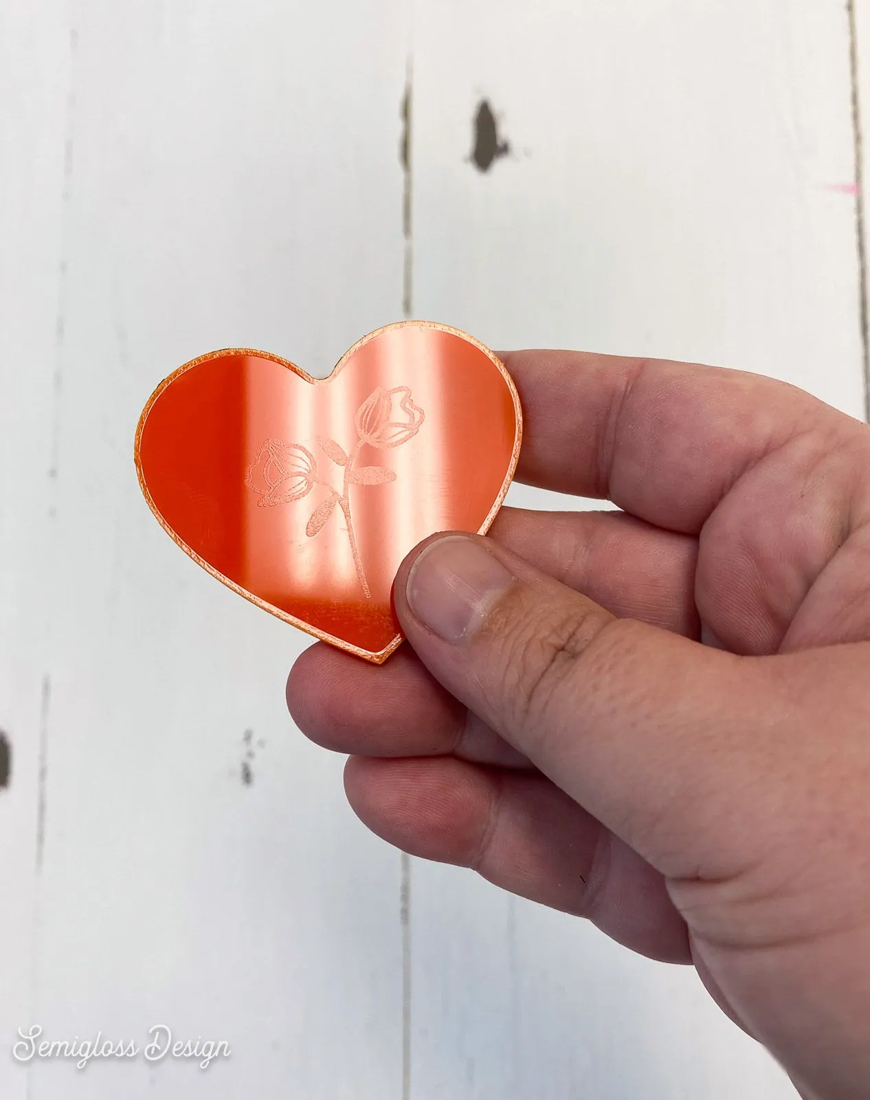 acrylic heart with flower engraved in it