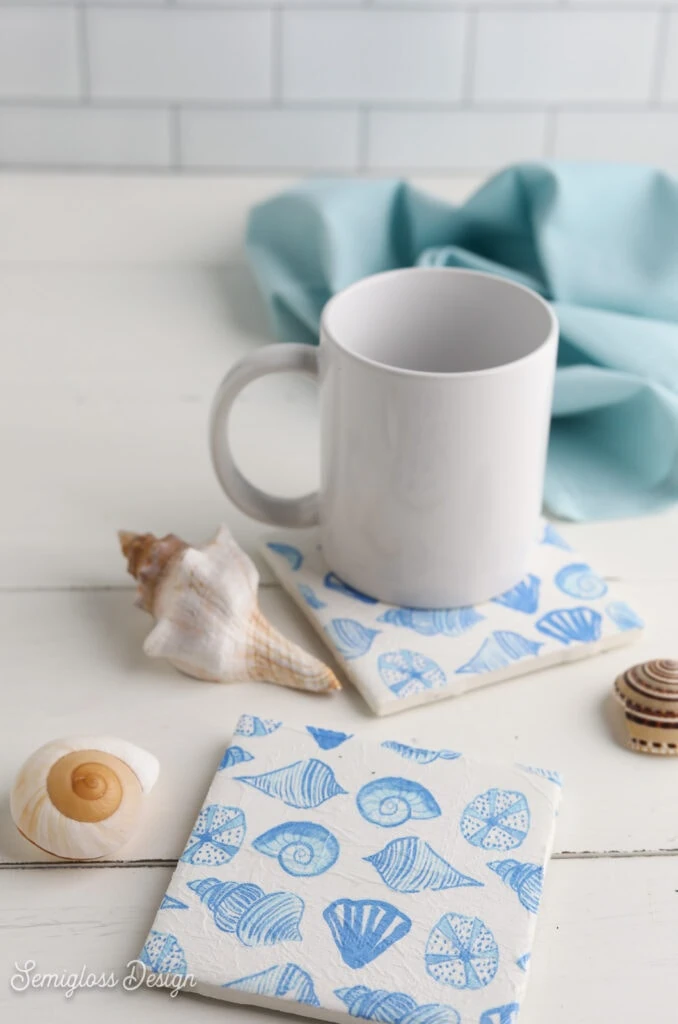 seashell printed coasters with mug and shells