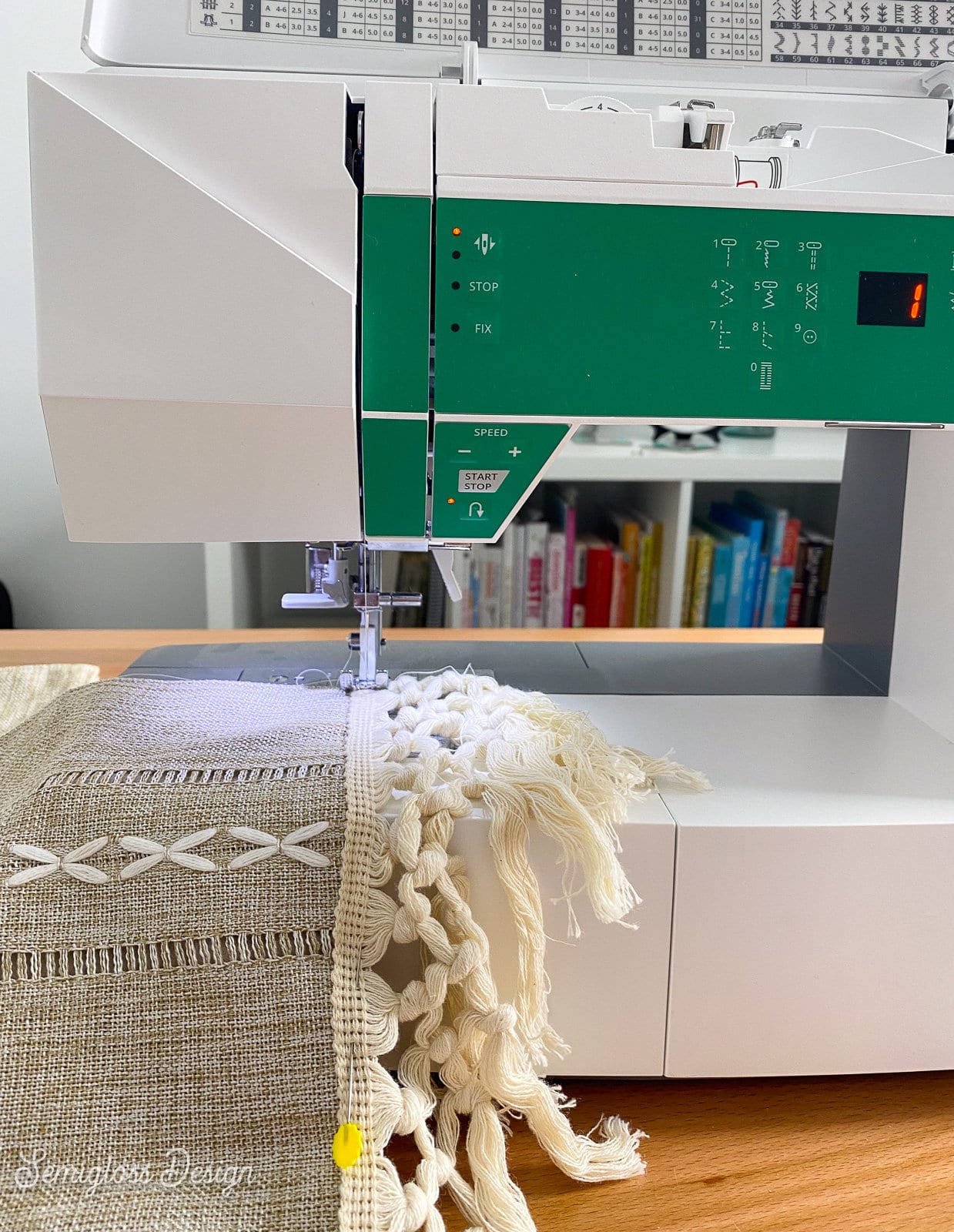 sewing machine being used to sew macrame to trim