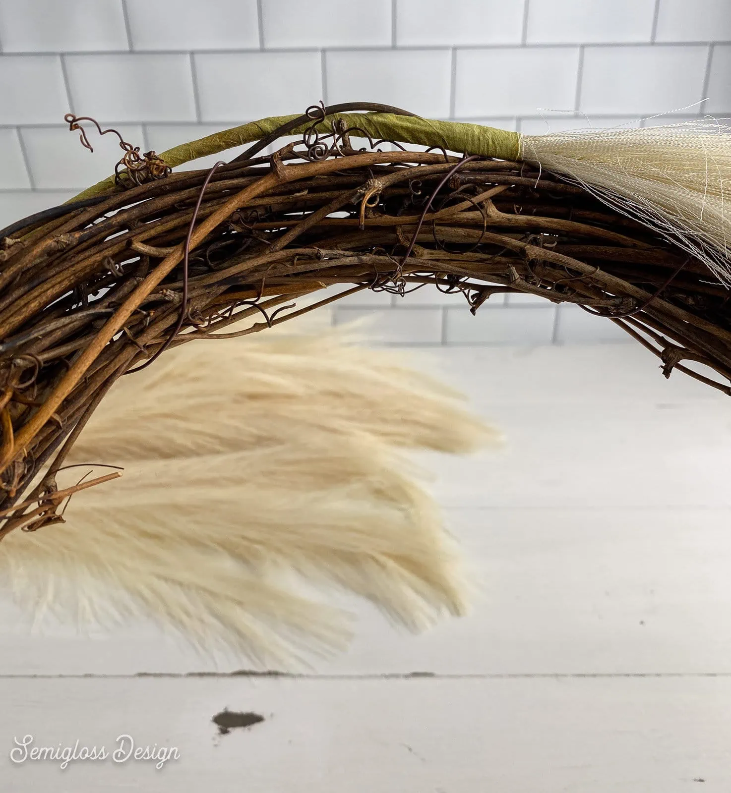 pampas grass stem in grapevine wreath