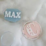 acrylic ornaments with pink and blue acrylic paint swashes and vinyl decals