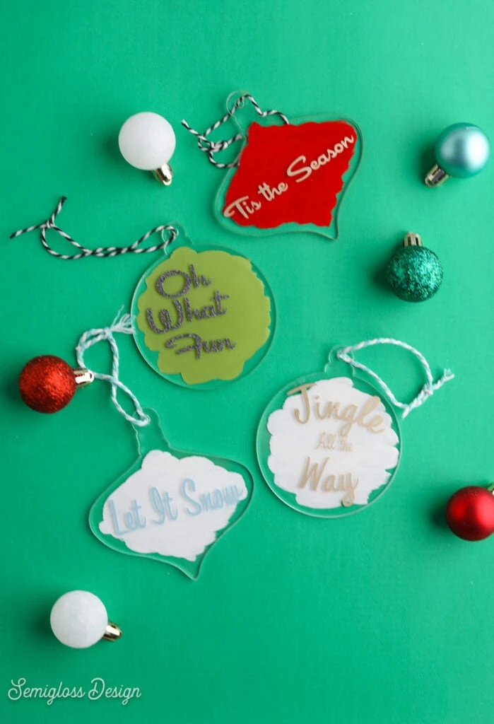 acrylic ornaments on green background