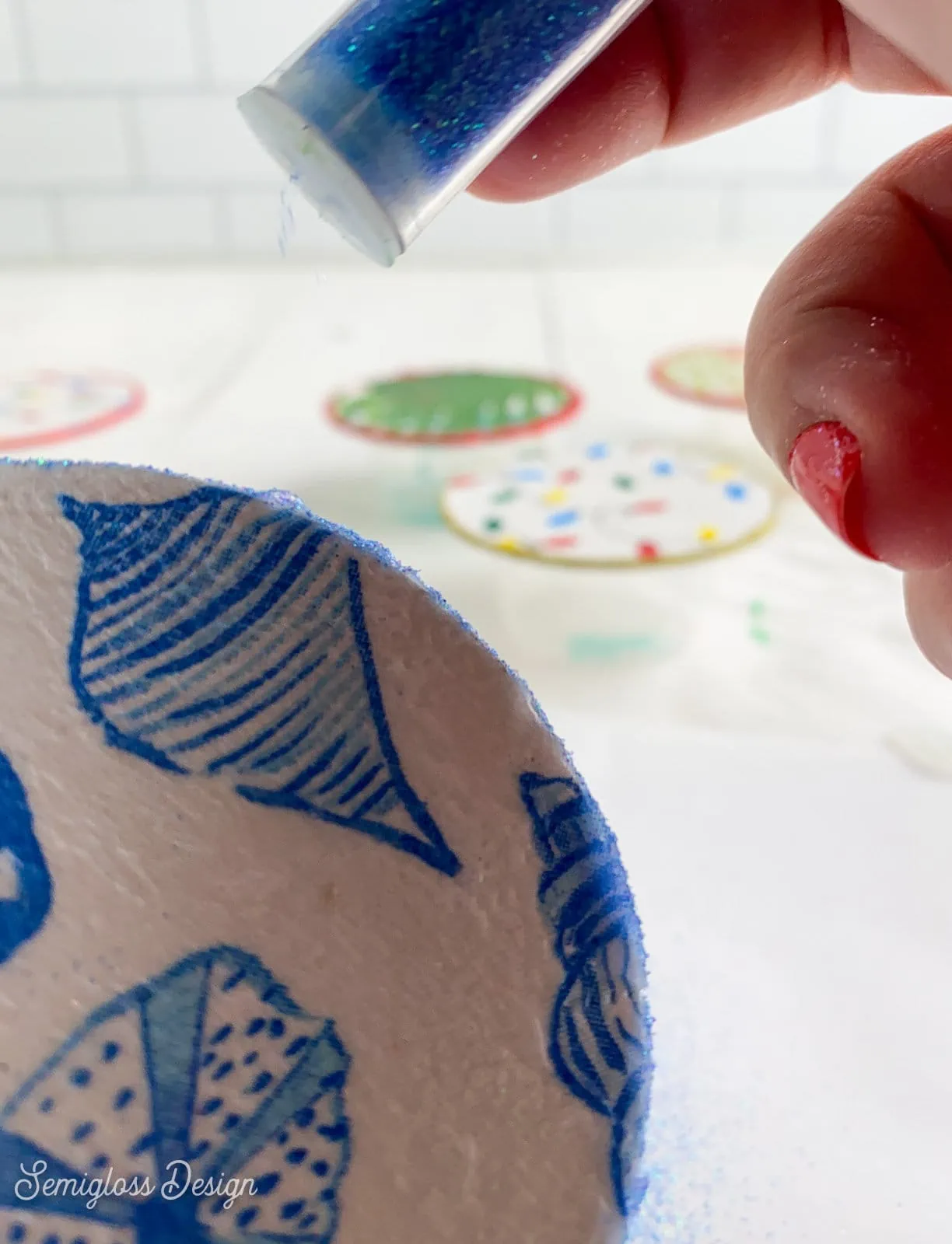 applying glitter on ornament