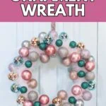 pastel tinsel and ornament wreath on door