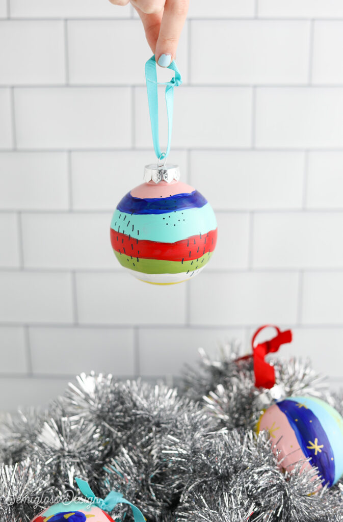 painted ornament held by hand