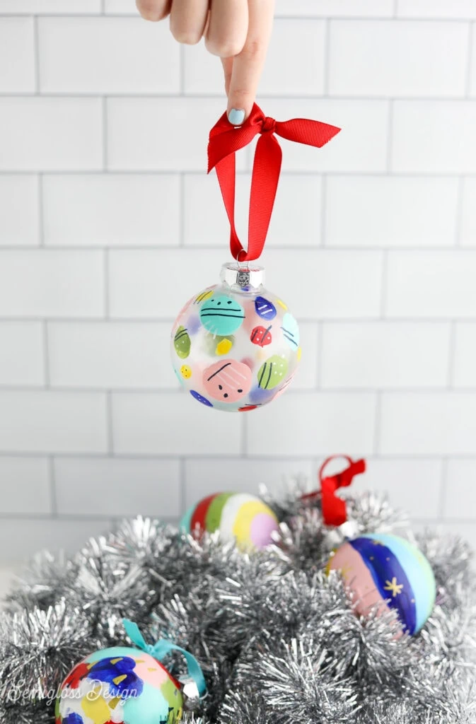 abstract painted ornament with pile of ornaments