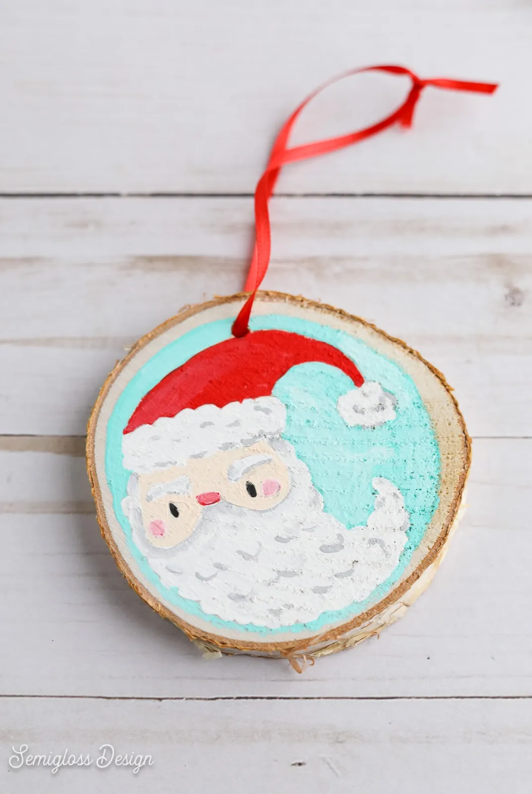 Santa painted on wood log ornament