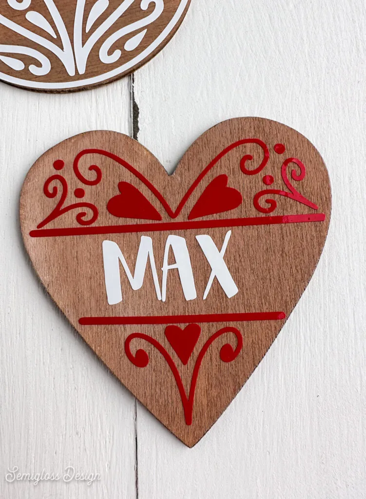 heart ornament with gingerbread icing decal and says "Max"