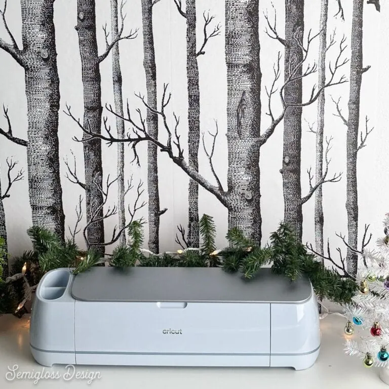 Cricut Maker 3 with tree wallpaper behind it