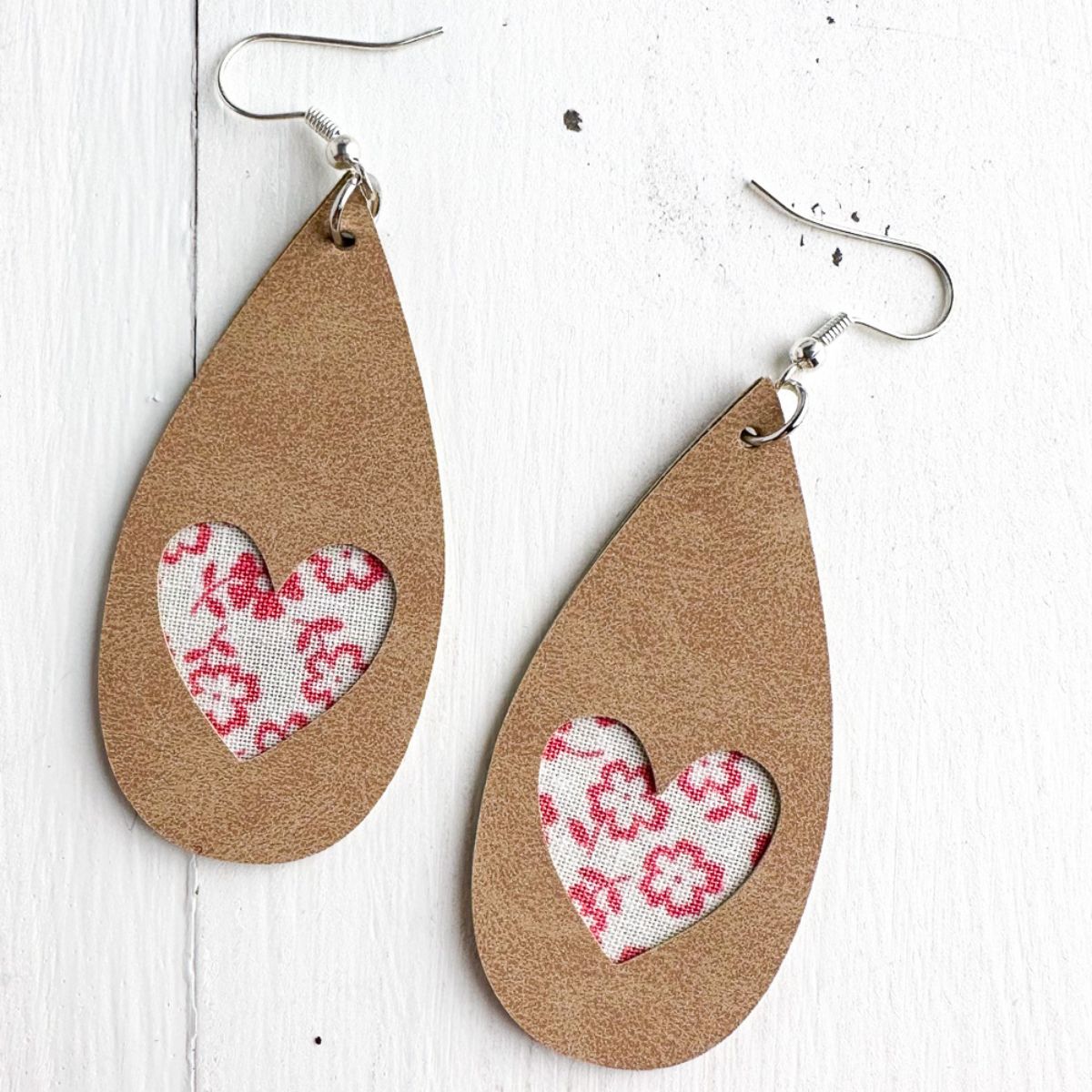 leather earrings with heart cutout and fabric insert