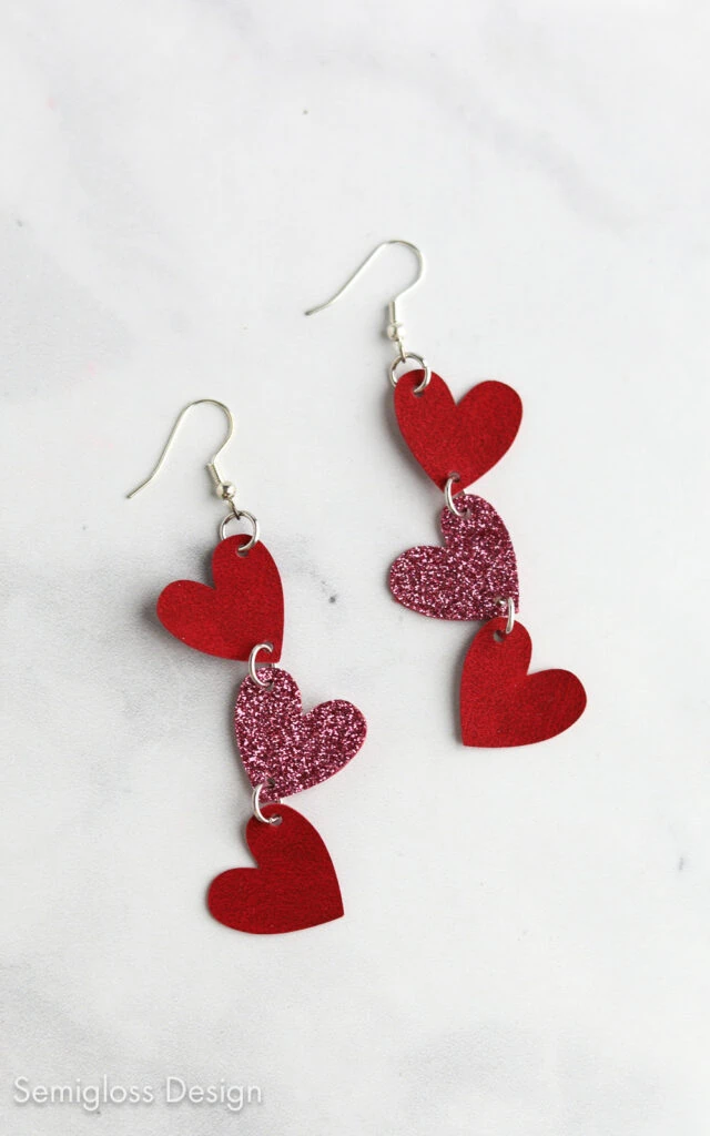 dangling heart earring made with iron-on vinyl and faux leather