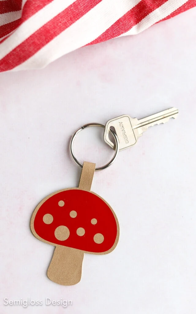 mushroom keychain with red and white linen napkin