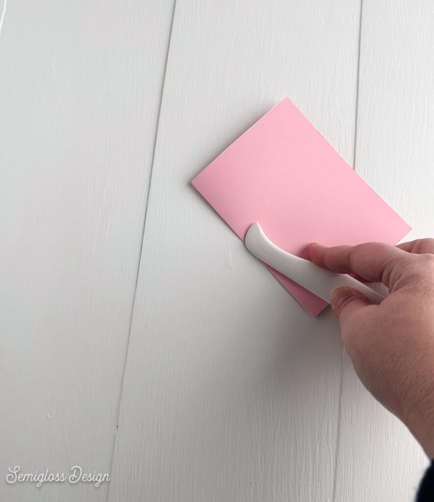 folding pink card with bone folder