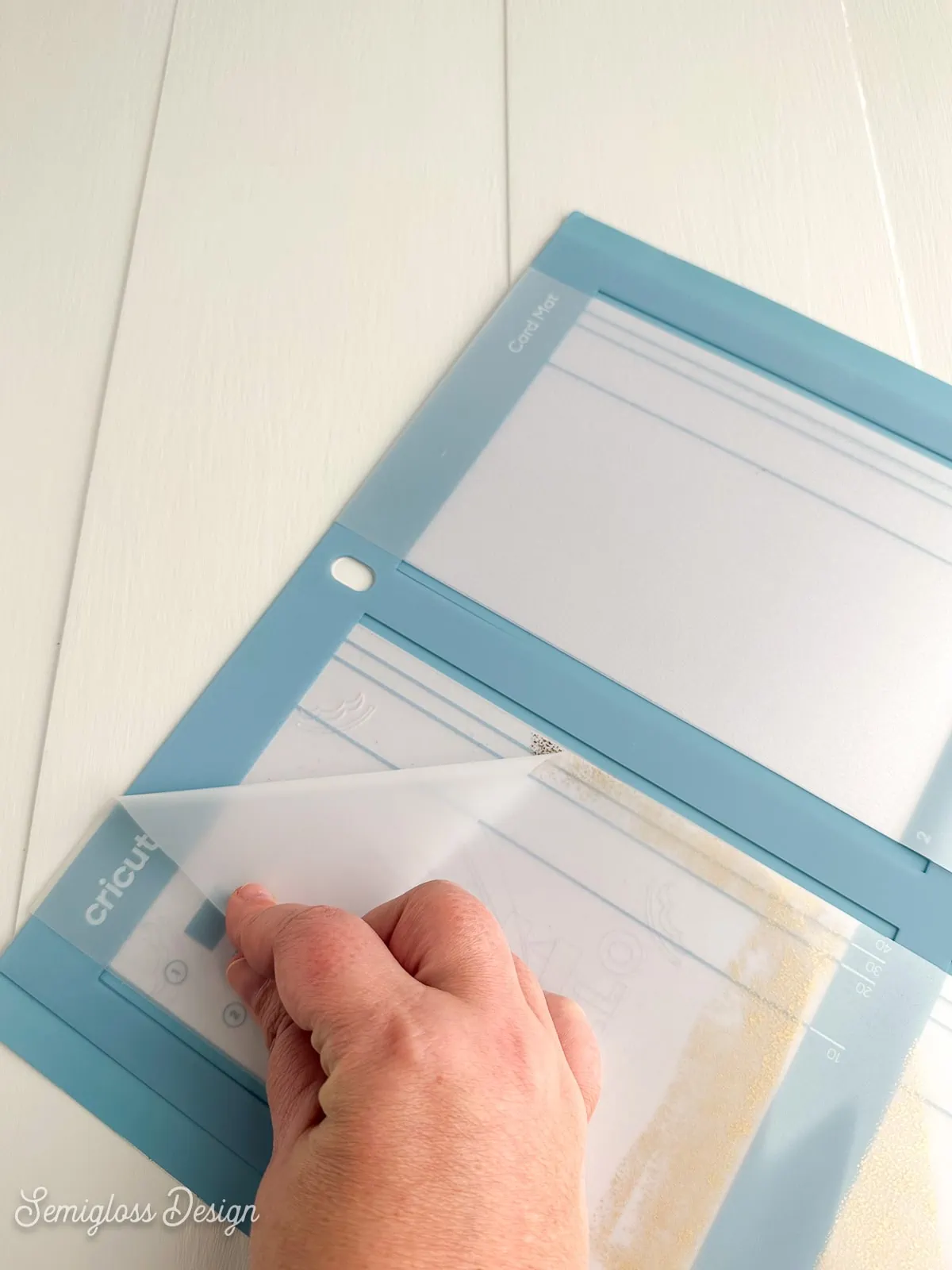 removing protector sheet from card mat